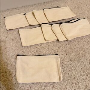BRAND NEW Set of 9 Cream Pouches with Black zipper